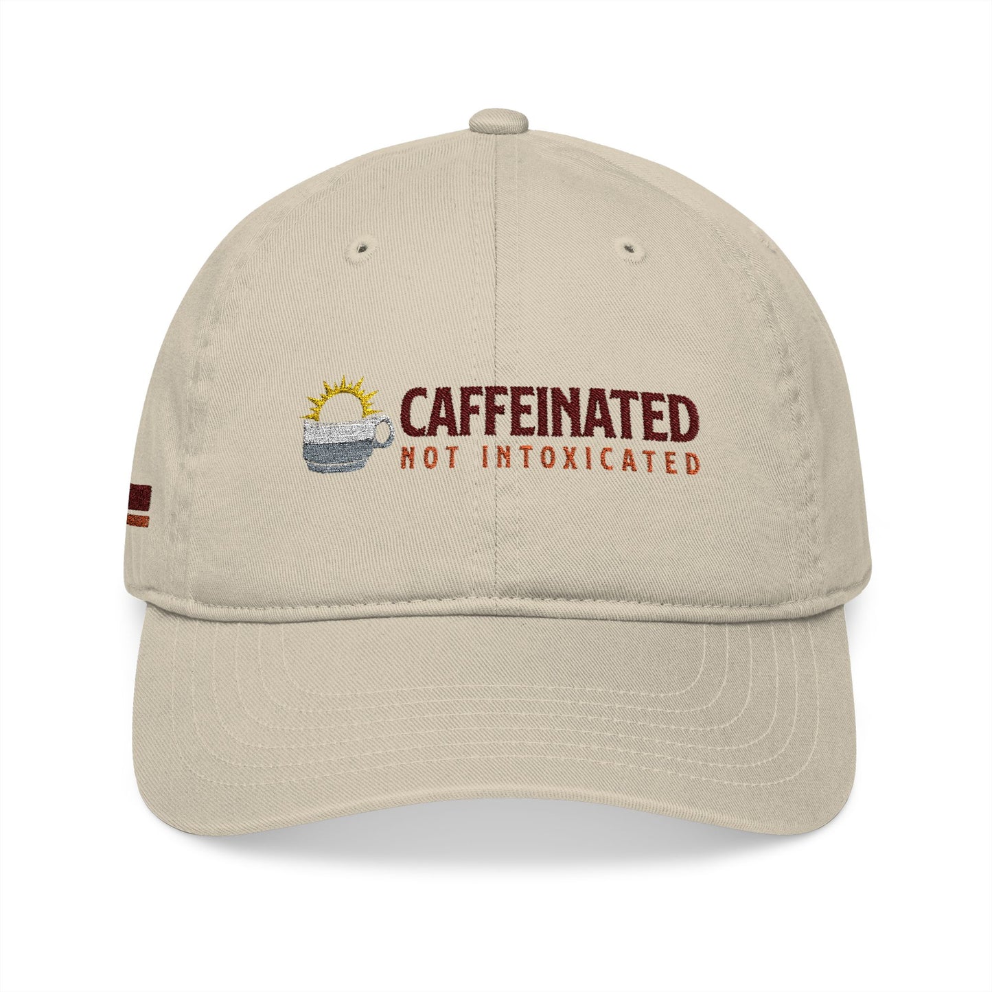 Recovery lifestyle cap with 'Caffeinated Not Intoxicated' text and coffee cup embroidery on a beige background